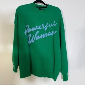Dressed in LALA Green Sweater with Blue Text